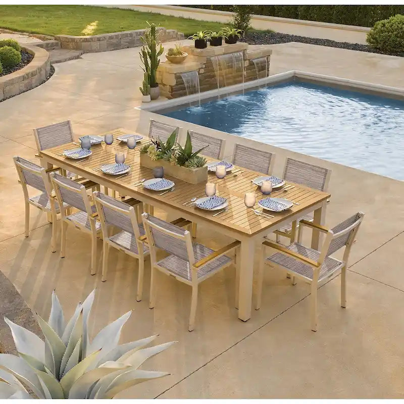 Oxford Garden Travira 11-piece 103-in x 42-in Tekwood Natural Table & Sling Armchair Dining Set - Bellows Sling